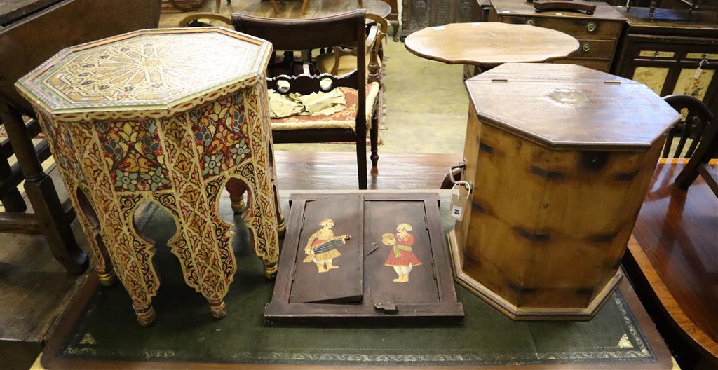 A Moroccan octagonal painted and decorated coffee table, an octagonal box with a hinged lid and an Indian two door wall panel